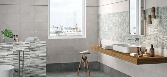 Koupelnový obklad Extreme v imitaci betonu je možné oživit různými dekoracemi včetně patchworkových, které imitují textil. | Vzory keramických imitací obkladů a dlažeb